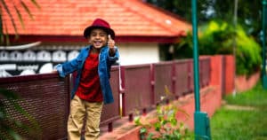 Smiling boy thumbs up